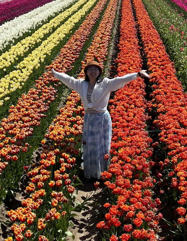 Jun Wen Chen in a colorful tulip field
